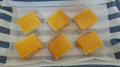 orange curd topped cheesecake slice